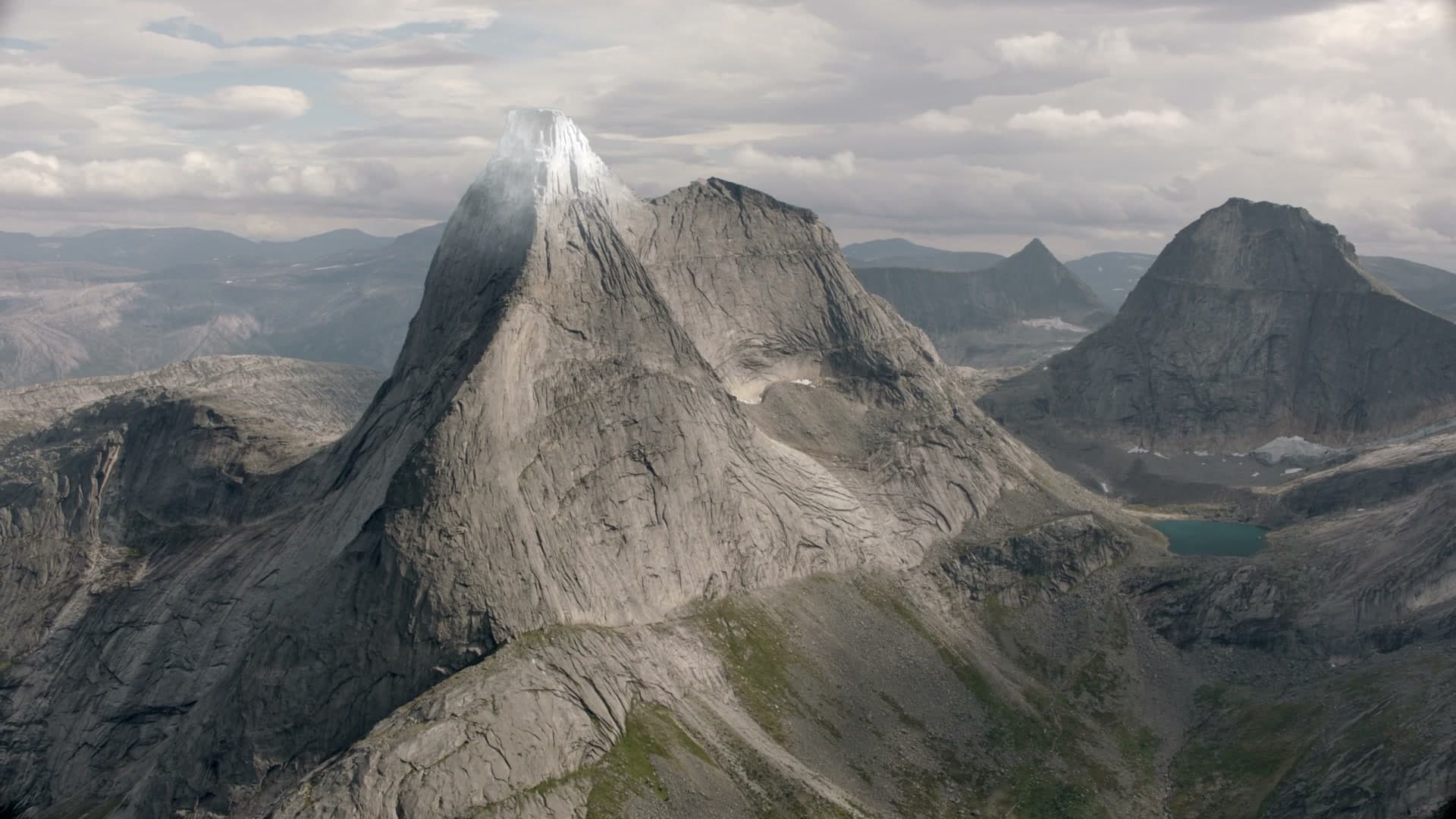 Summit — aerial view of an Arctic peak with added snow